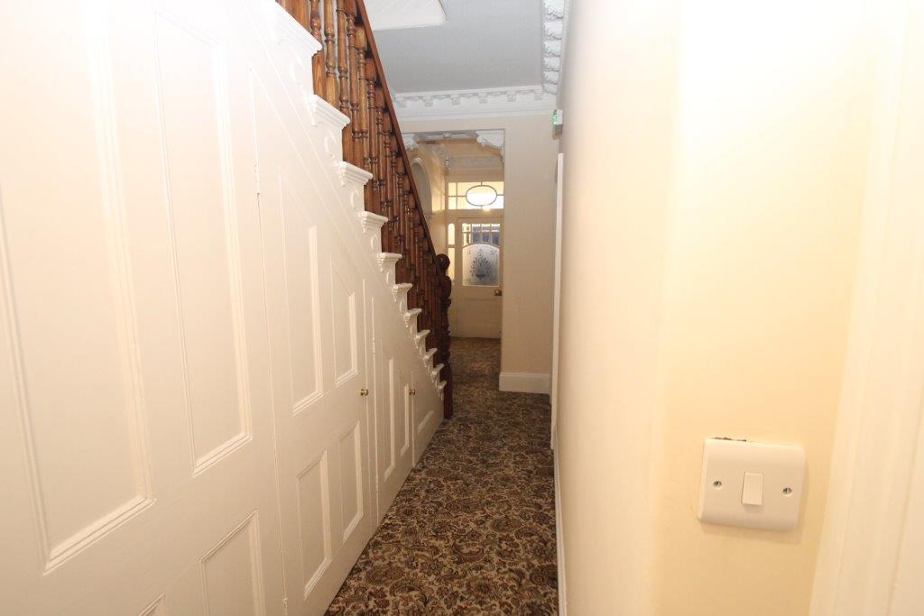 Downstairs hallway leading to front door