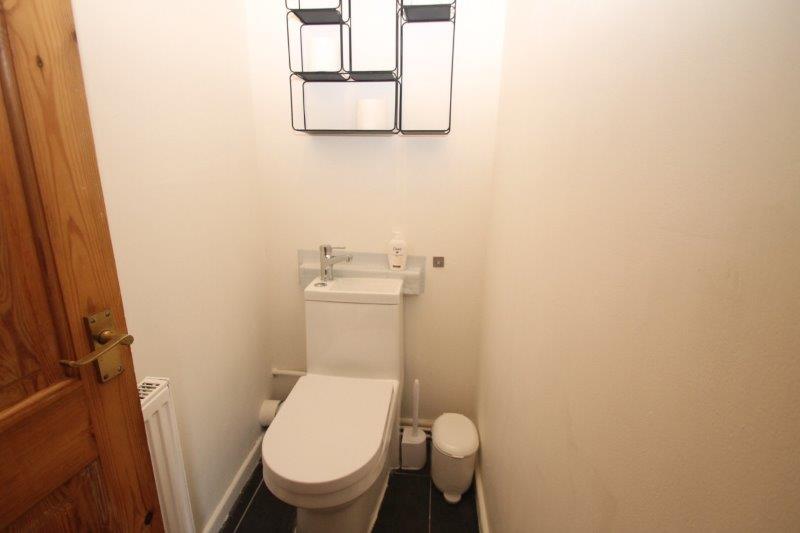 separate WC with shelving above toilers