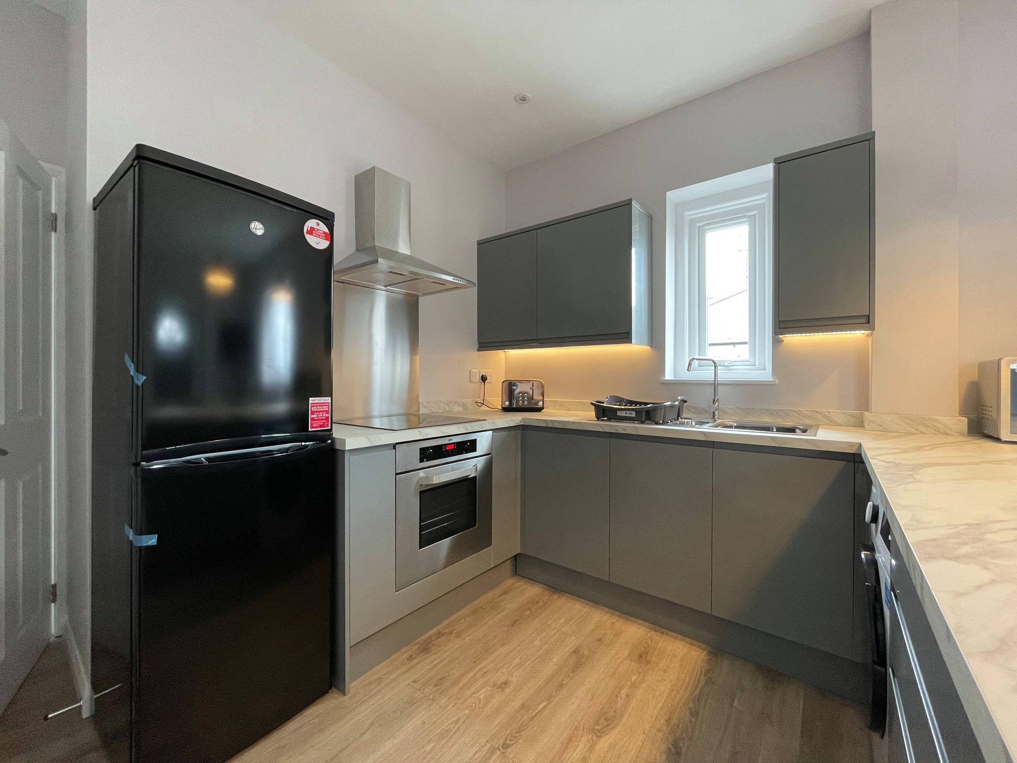 Shared kitchen with fridge freezer, hob and cooker