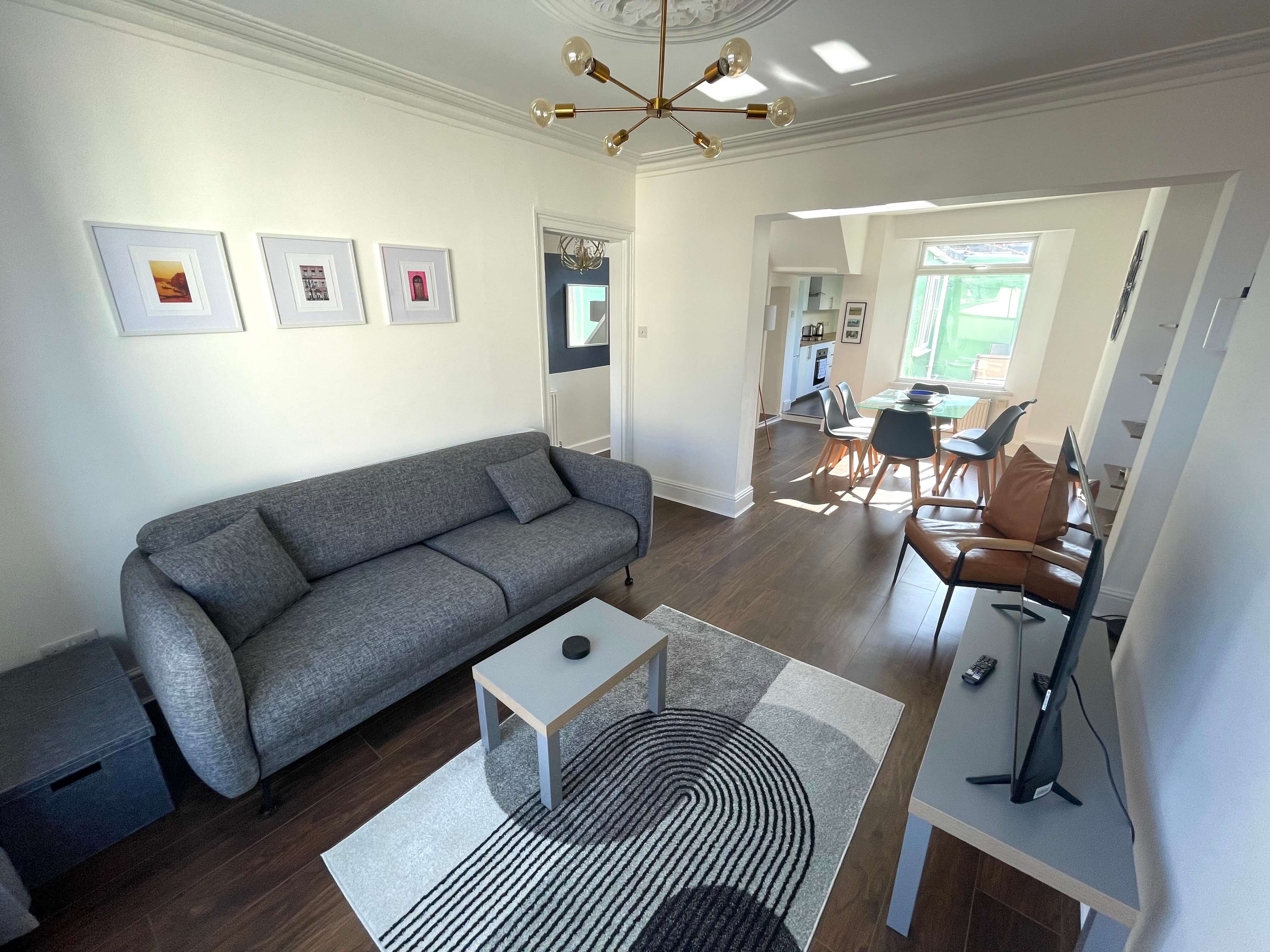 open plan living and dining area leading into kitchen