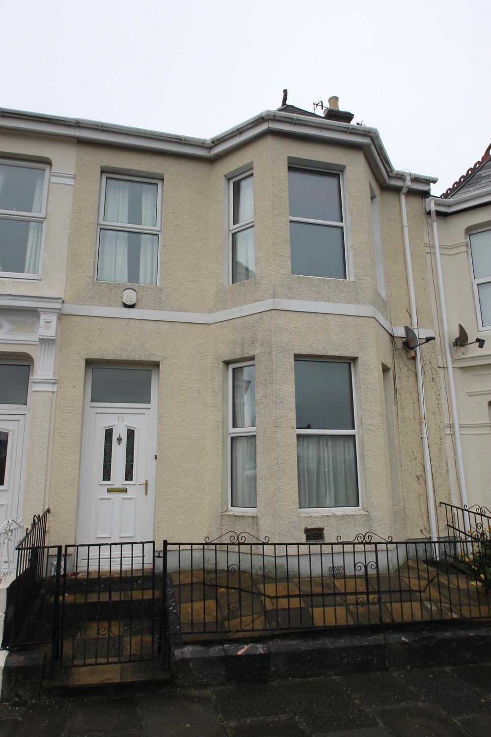 Front of property, yellow building