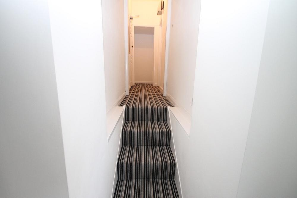 hallway and stars leading to flat