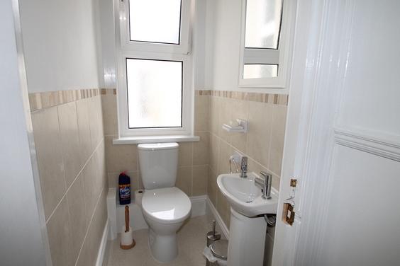 Separate WC with sink and mirror above sink