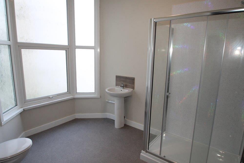 shared bathroom with large shower