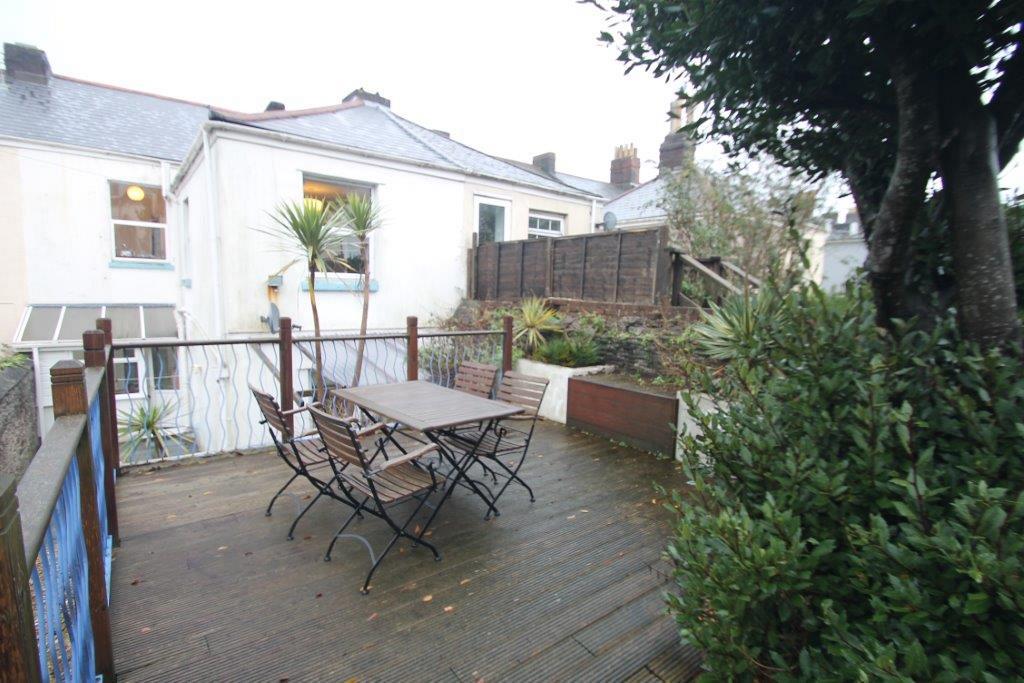 property decking terrace with outdoor furniture with four chairs