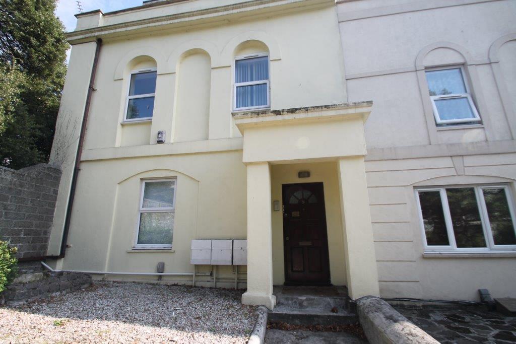 Exterior of property, off-white building