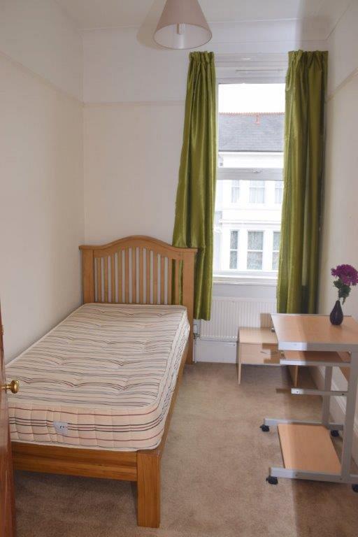 box room with single bed and bedside table