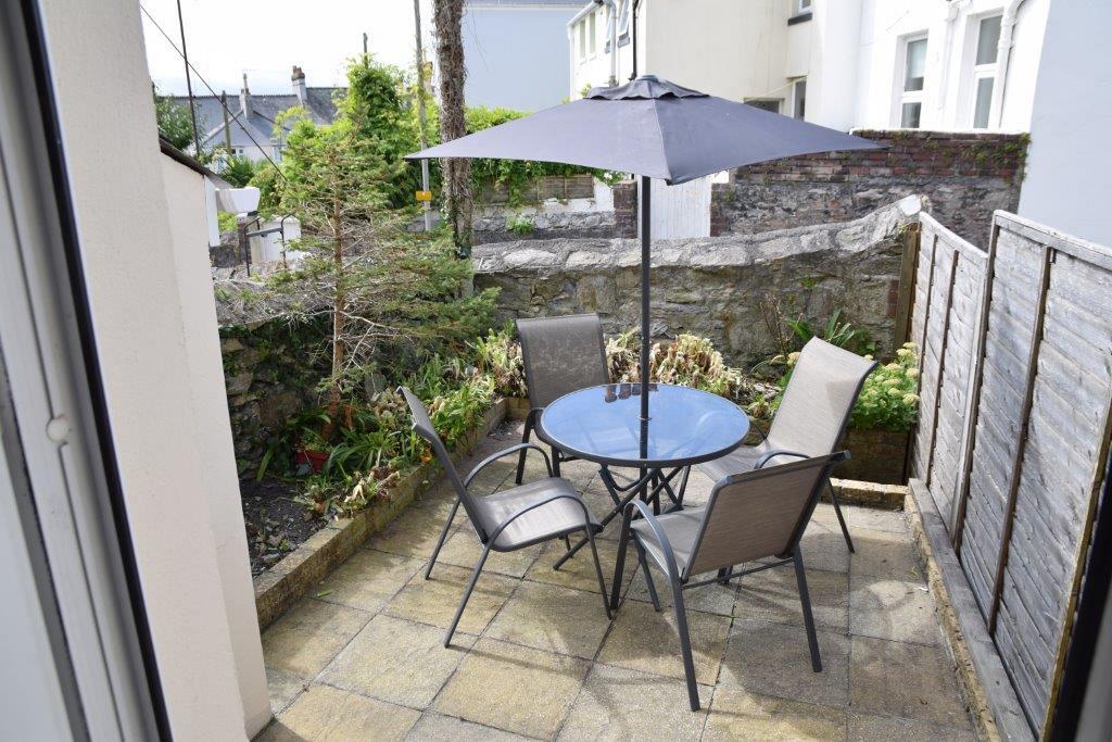 Shared back patio with outside furniture