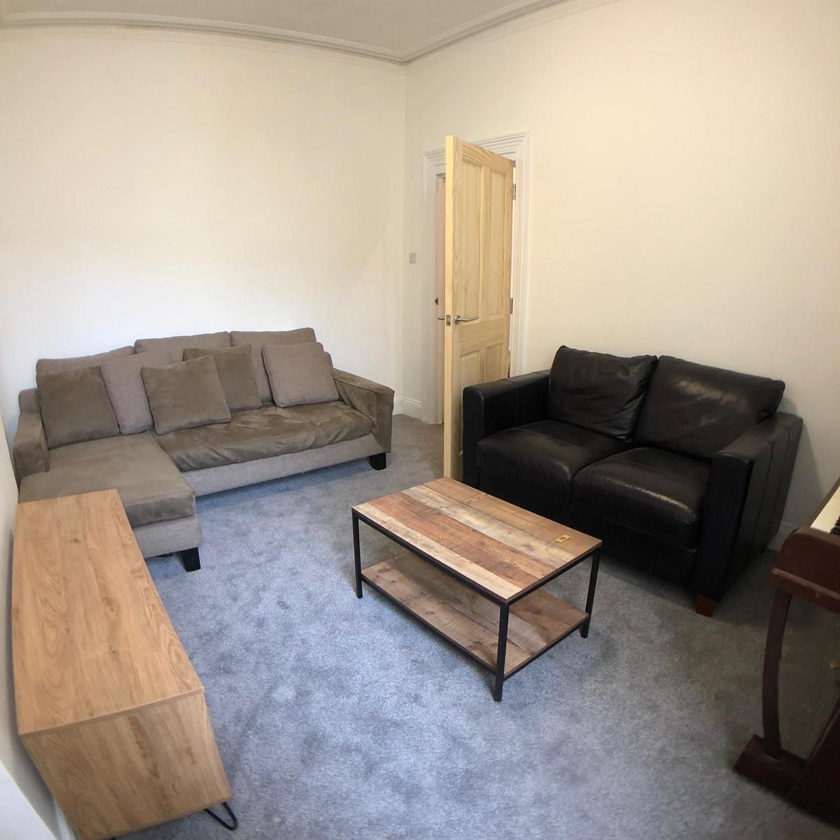 shared living room with two double sofas 