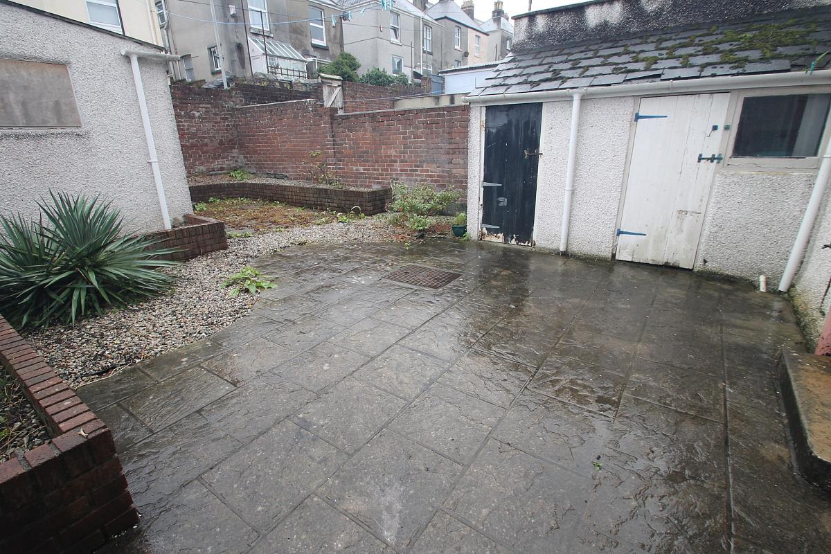 Back patio area with sheds