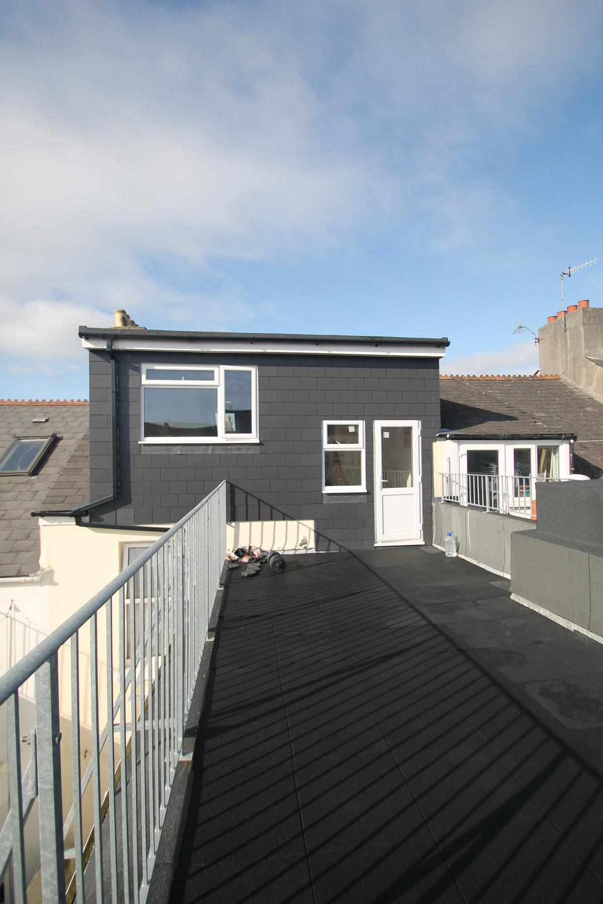 Balcony on the top of house, facing the back of the property