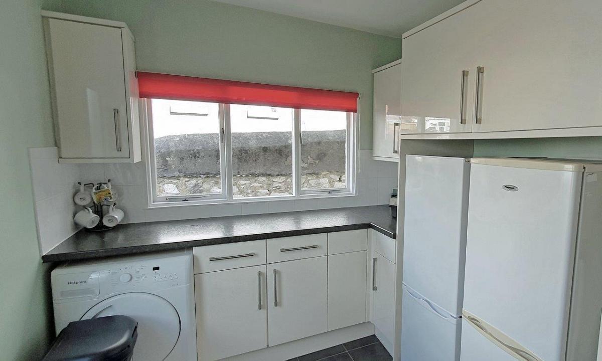 Shared kitchen with two fridge freezers, tumble dryer and 3 large windows