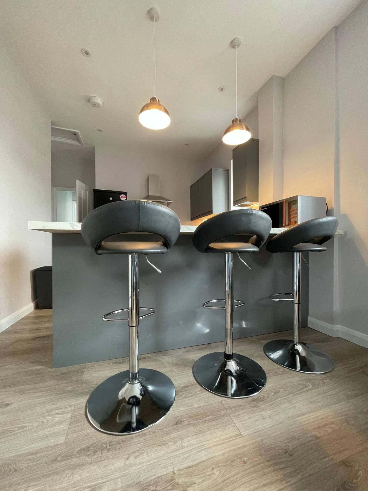 Breakfast bar facing the shared kitchen