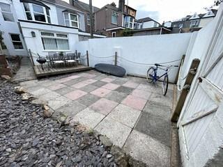 back patio with outdoor furniture and plenty of space for social gatherings