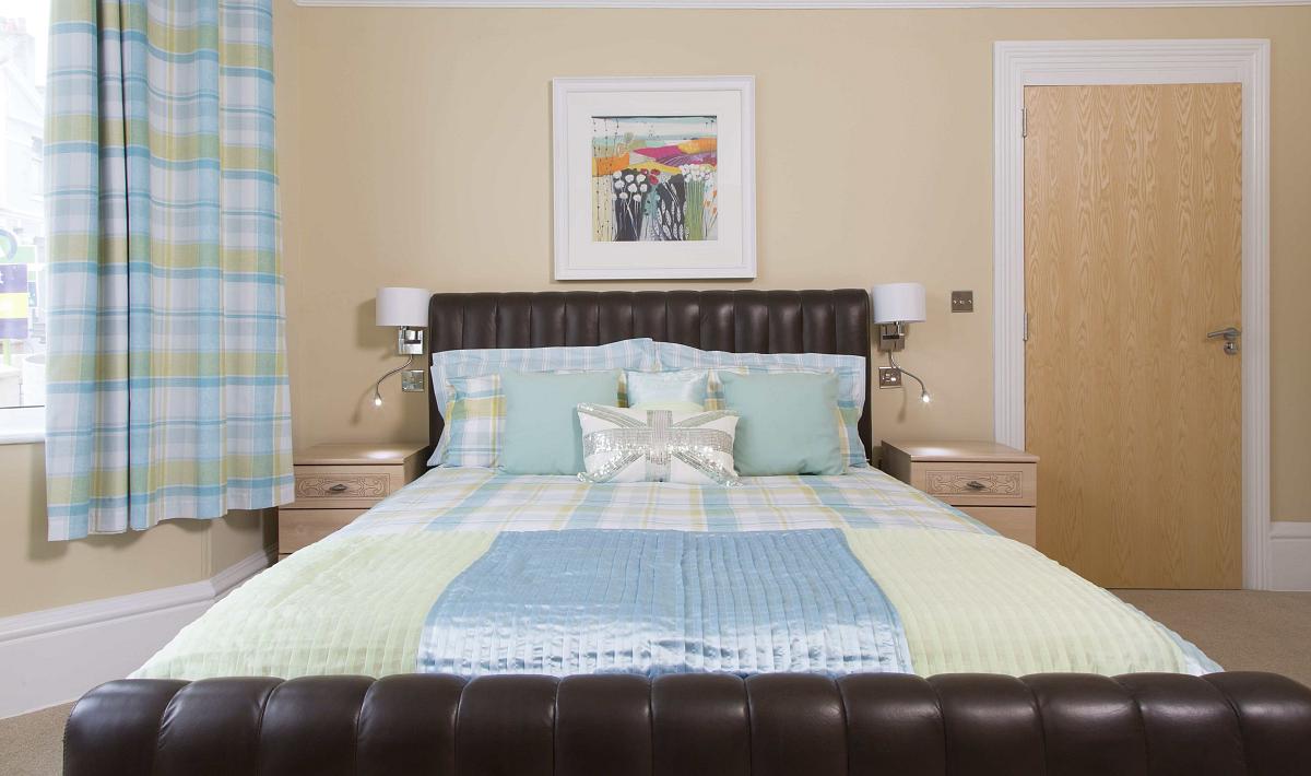 Second student bedroom with double bed and two bedside tables