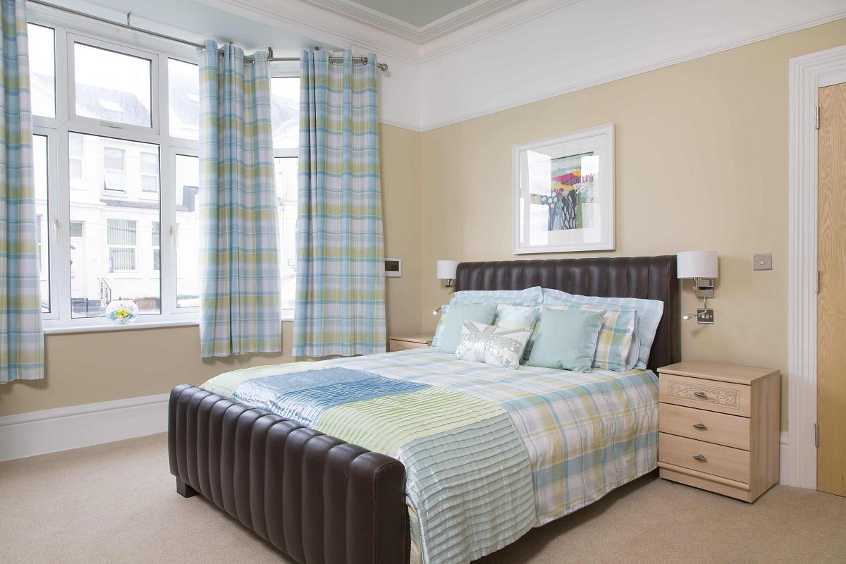 Second student bedroom with double bed and two bedside tables