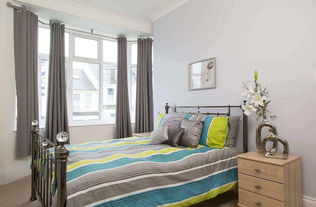 Third student room with double bed with two chest of drawers