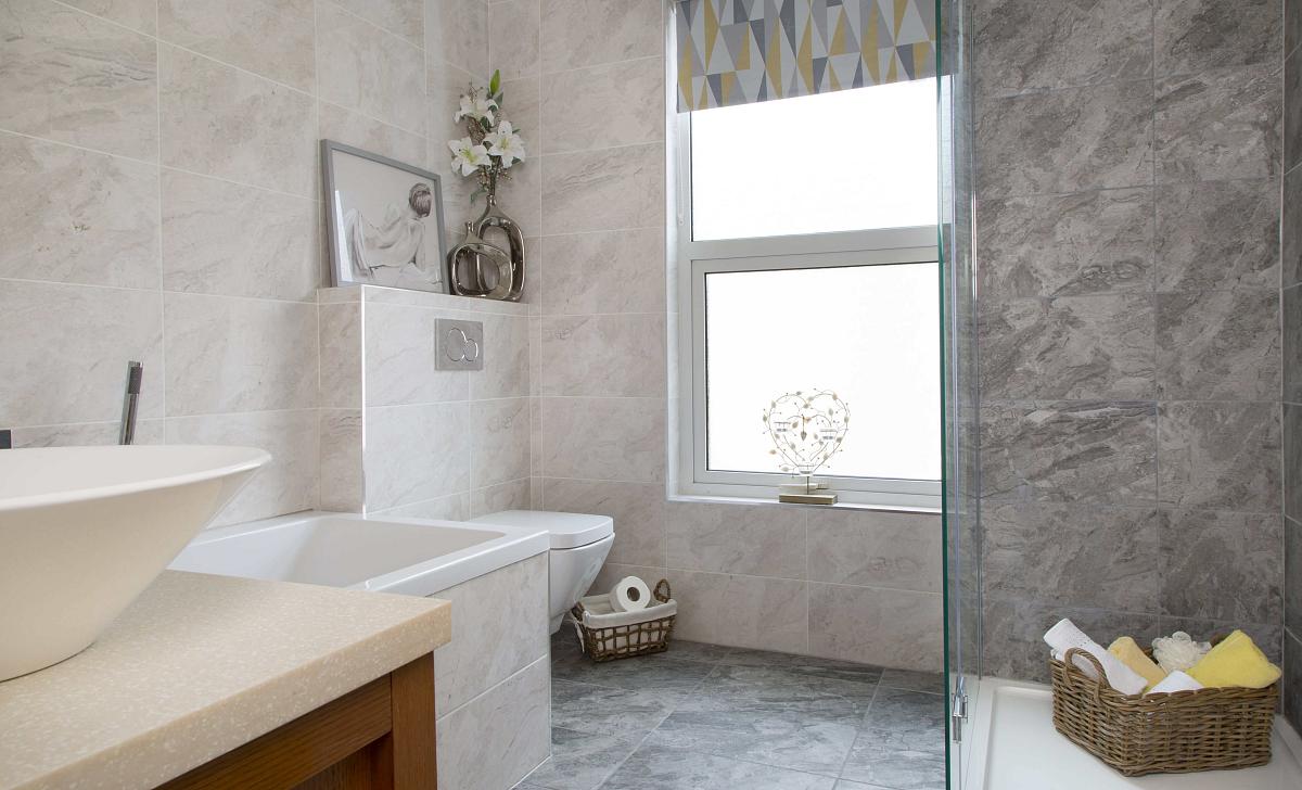 Shared bathroom with large bath and shower