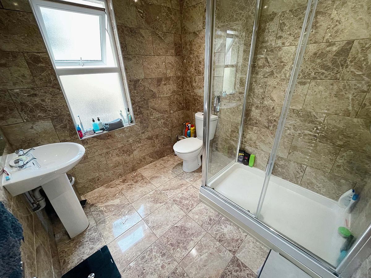 Shared bathroom with large shower