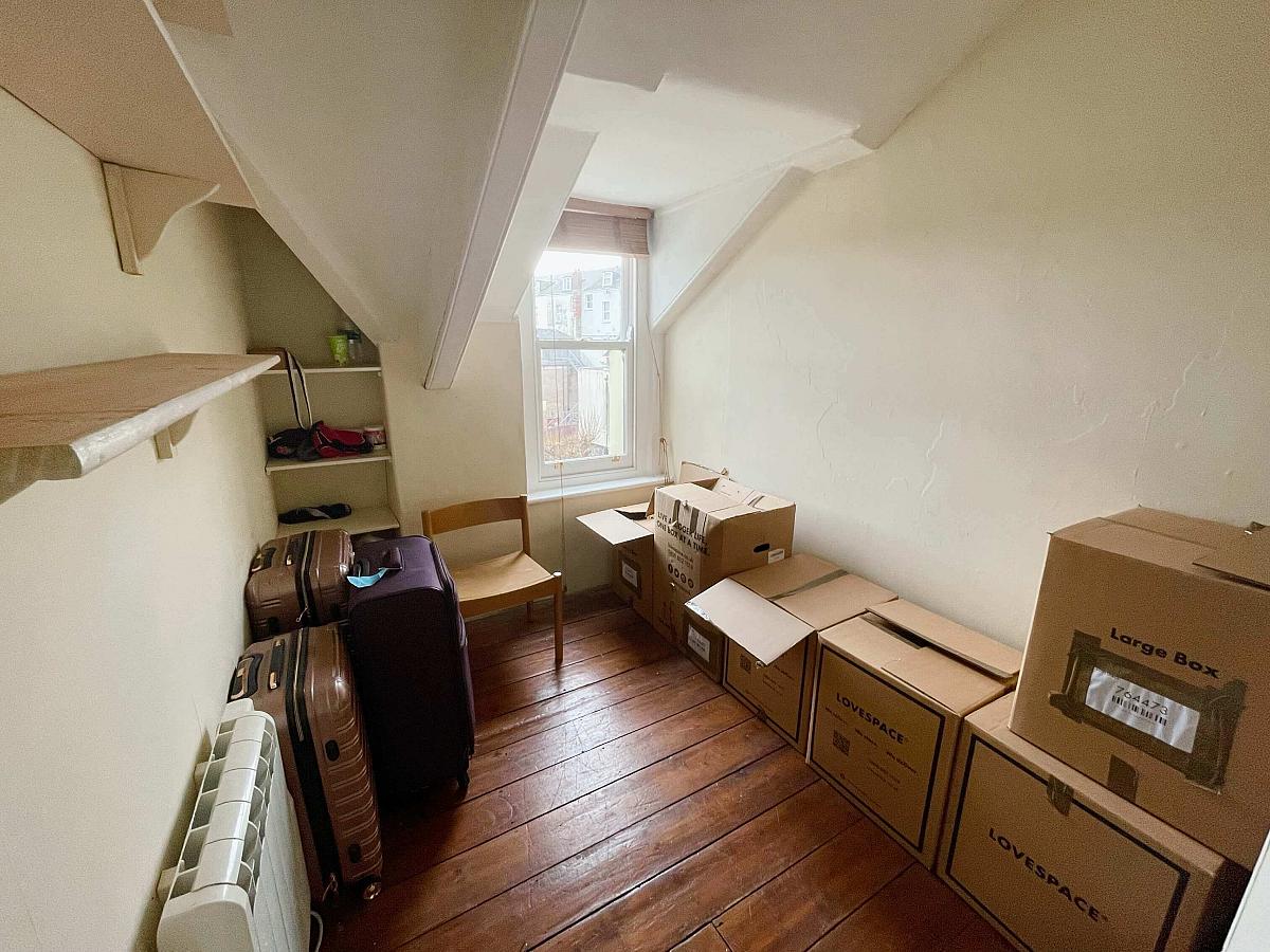 Box room with shelving for storage
