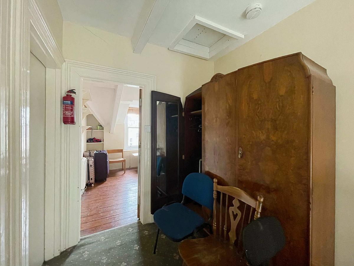 Hallways leading to box room with large 3 door wardrobe