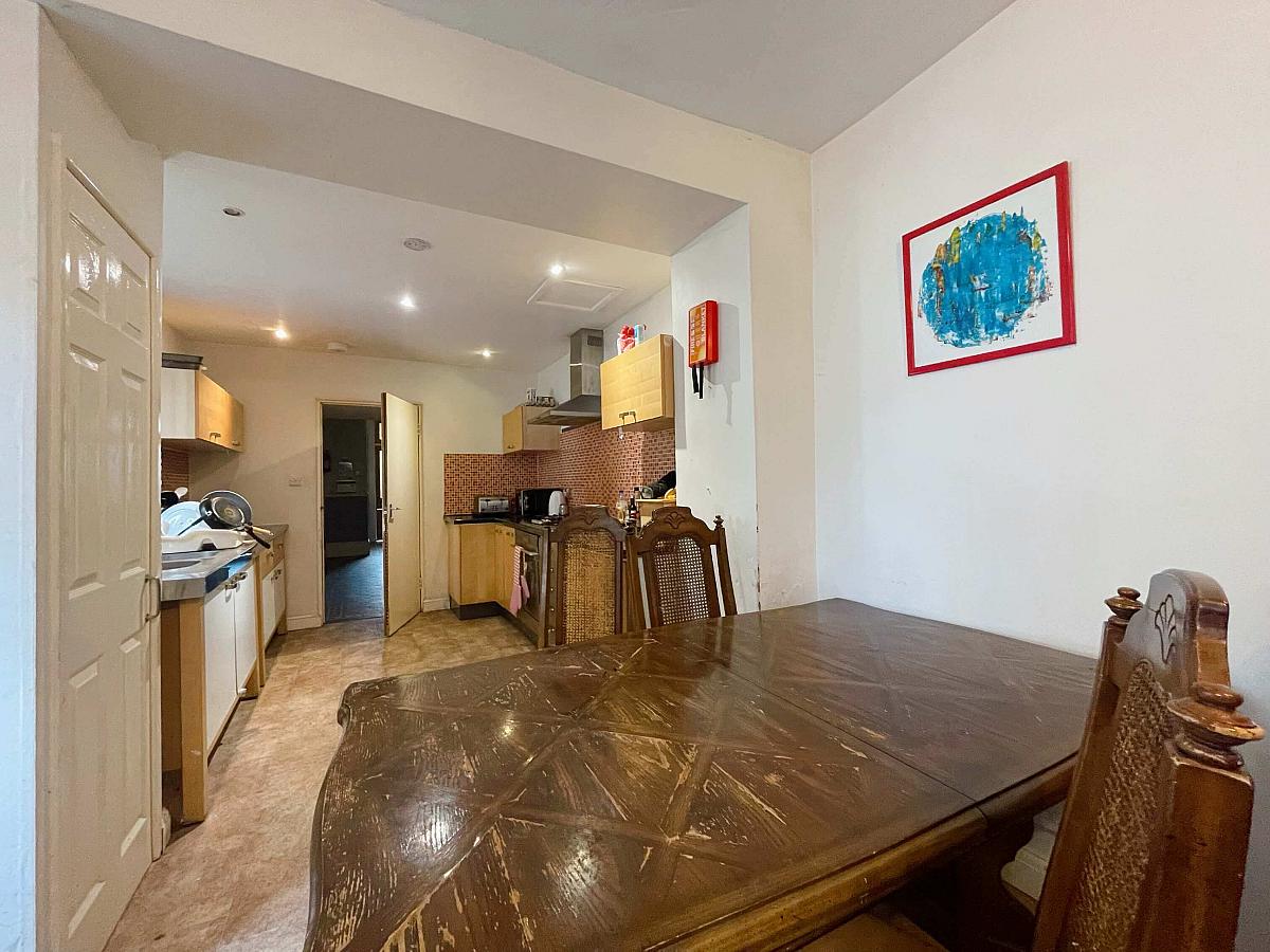 Shared kitchen area with dining table