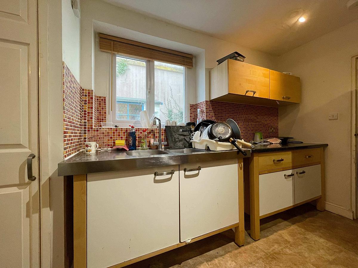 Shared kitchen are with double sink