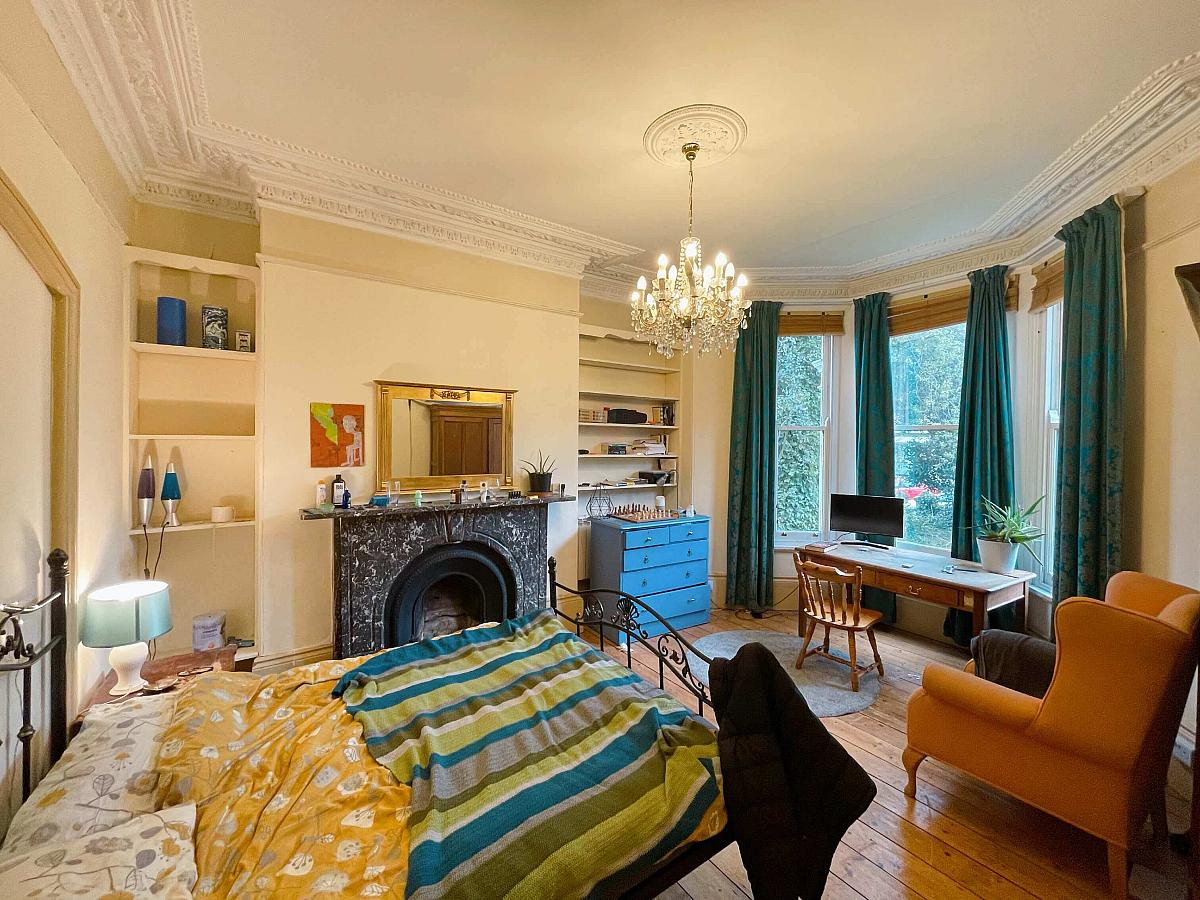 first student room double bed with desk, chest of drawers and arm chair