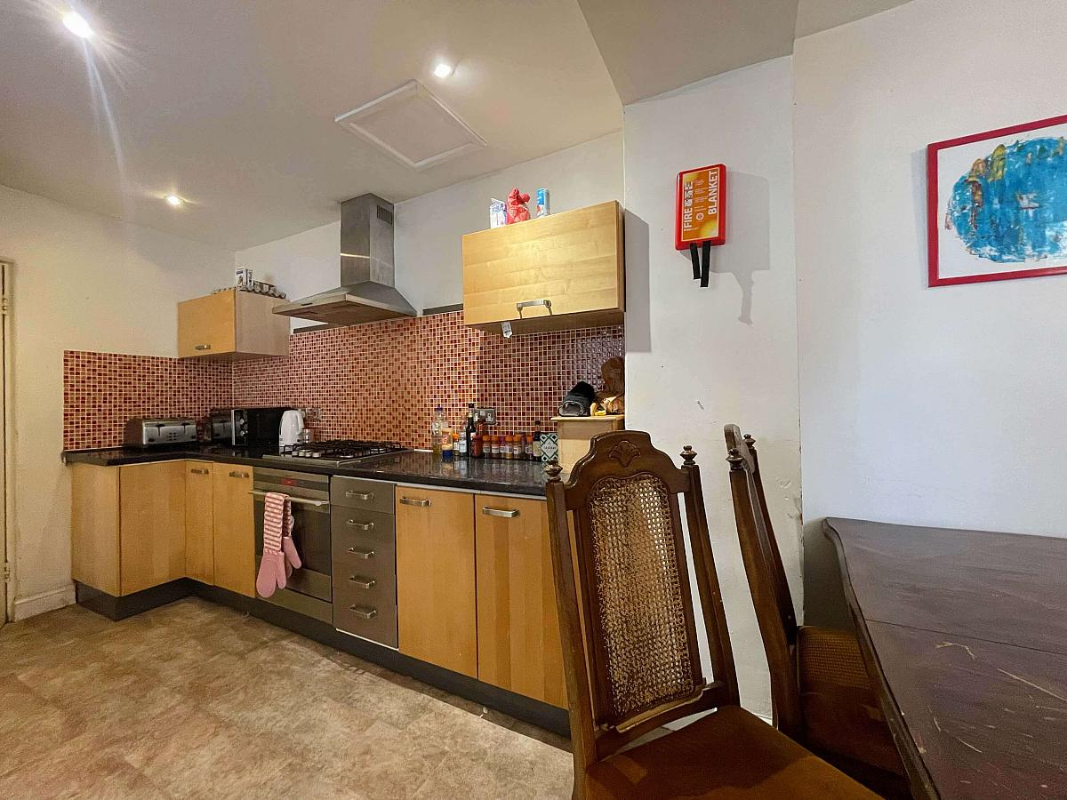 Shared kitchen area with dining table