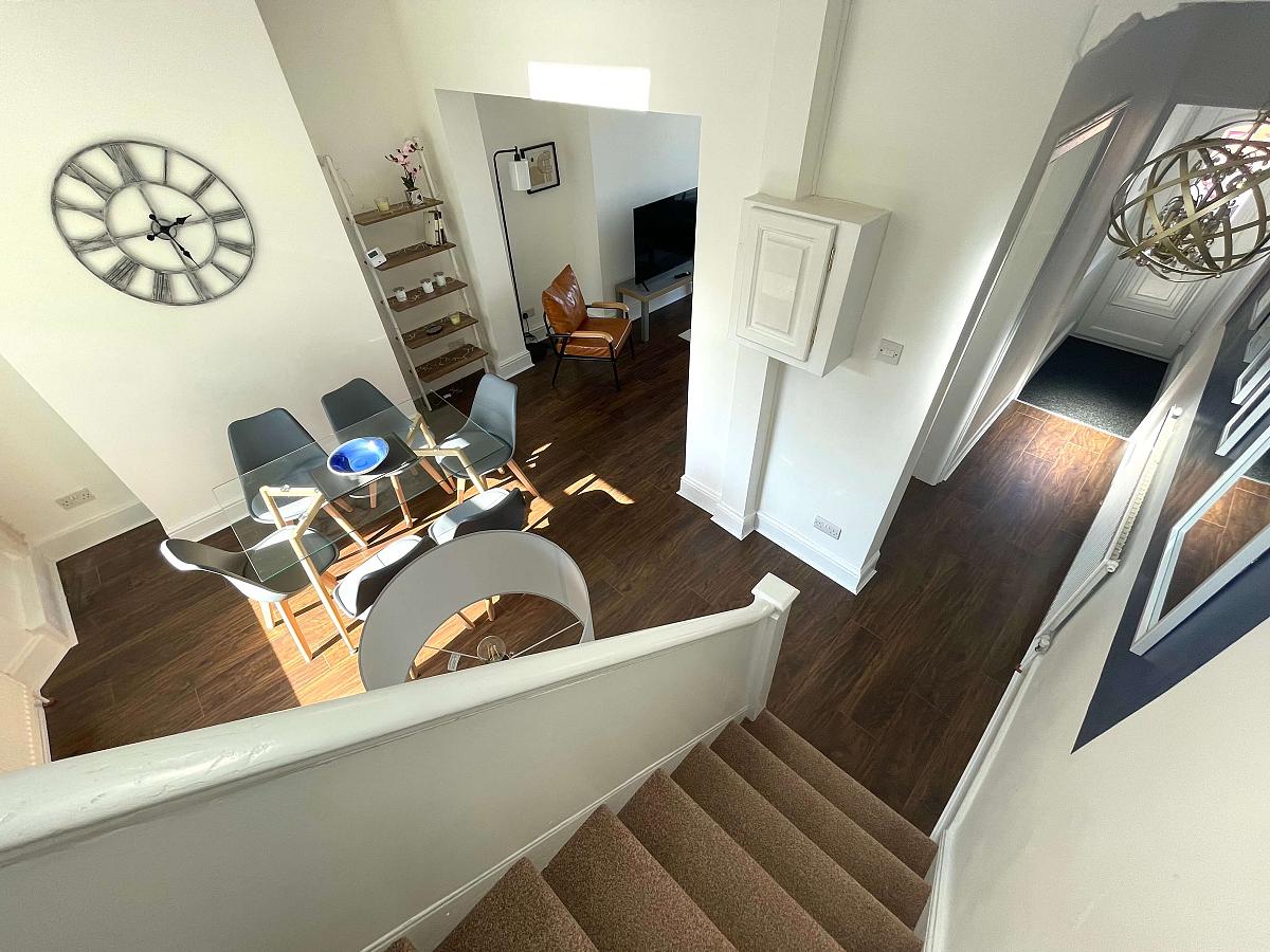 View from the stairs, looking down on dining area