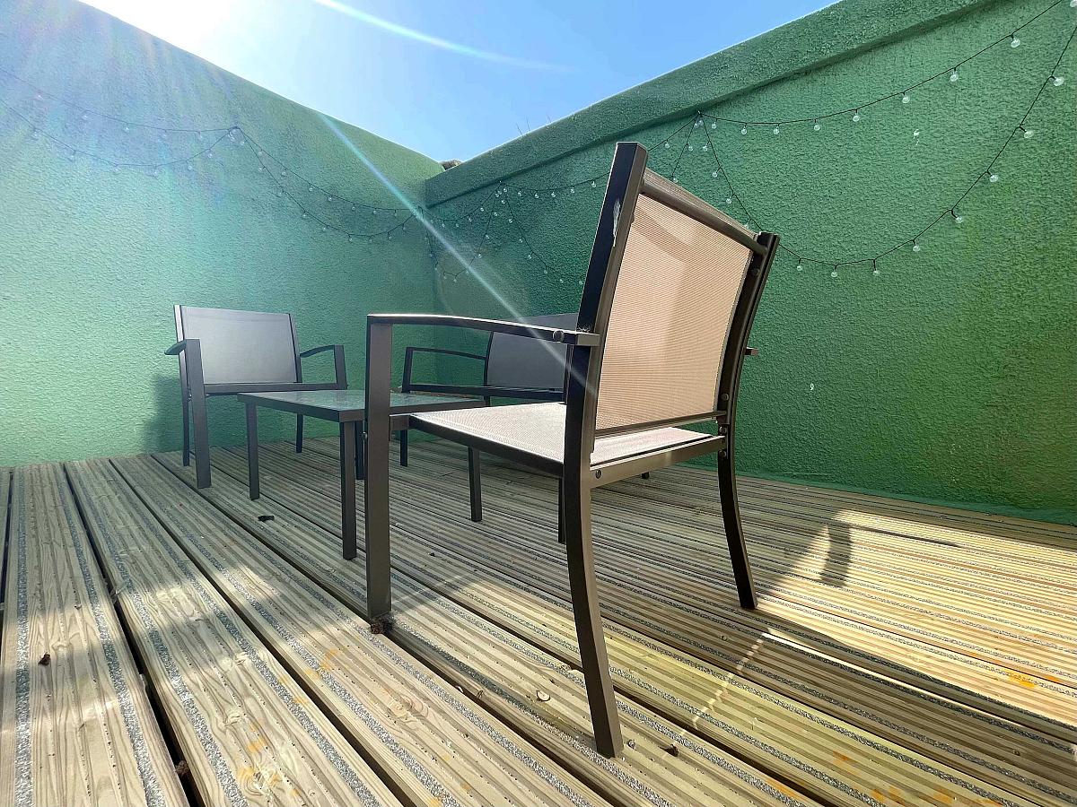 Shared back garden with decking and outside seating
