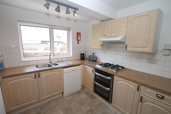 shared kitchen with dishwasher and cooker