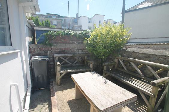 shared back garden with seating
