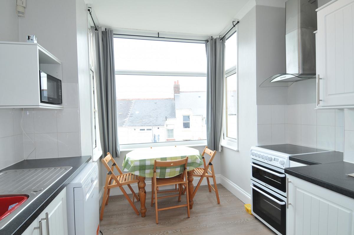 shared kitchen with dining table 
