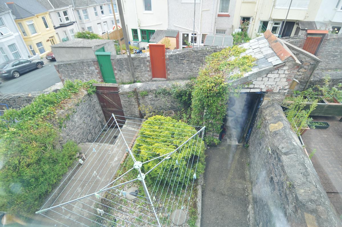 shared back garden with washing line and outside WC