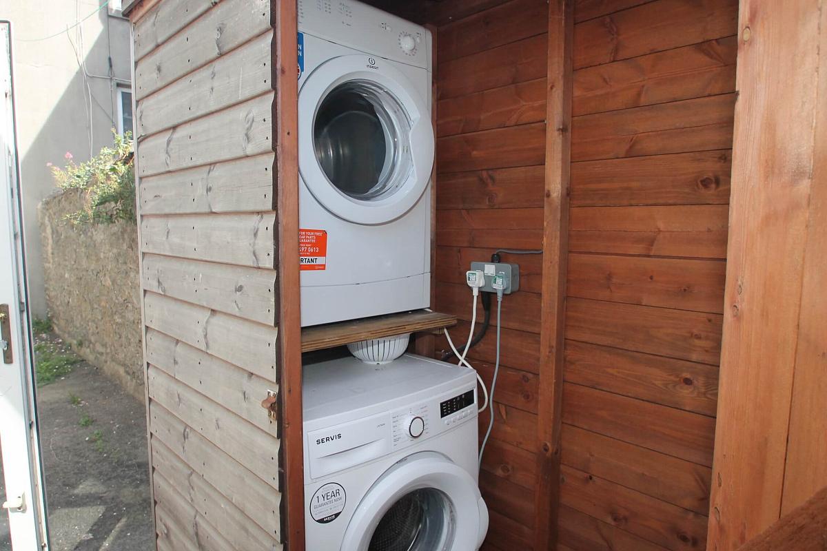 outside shed with washing machine and dryer 