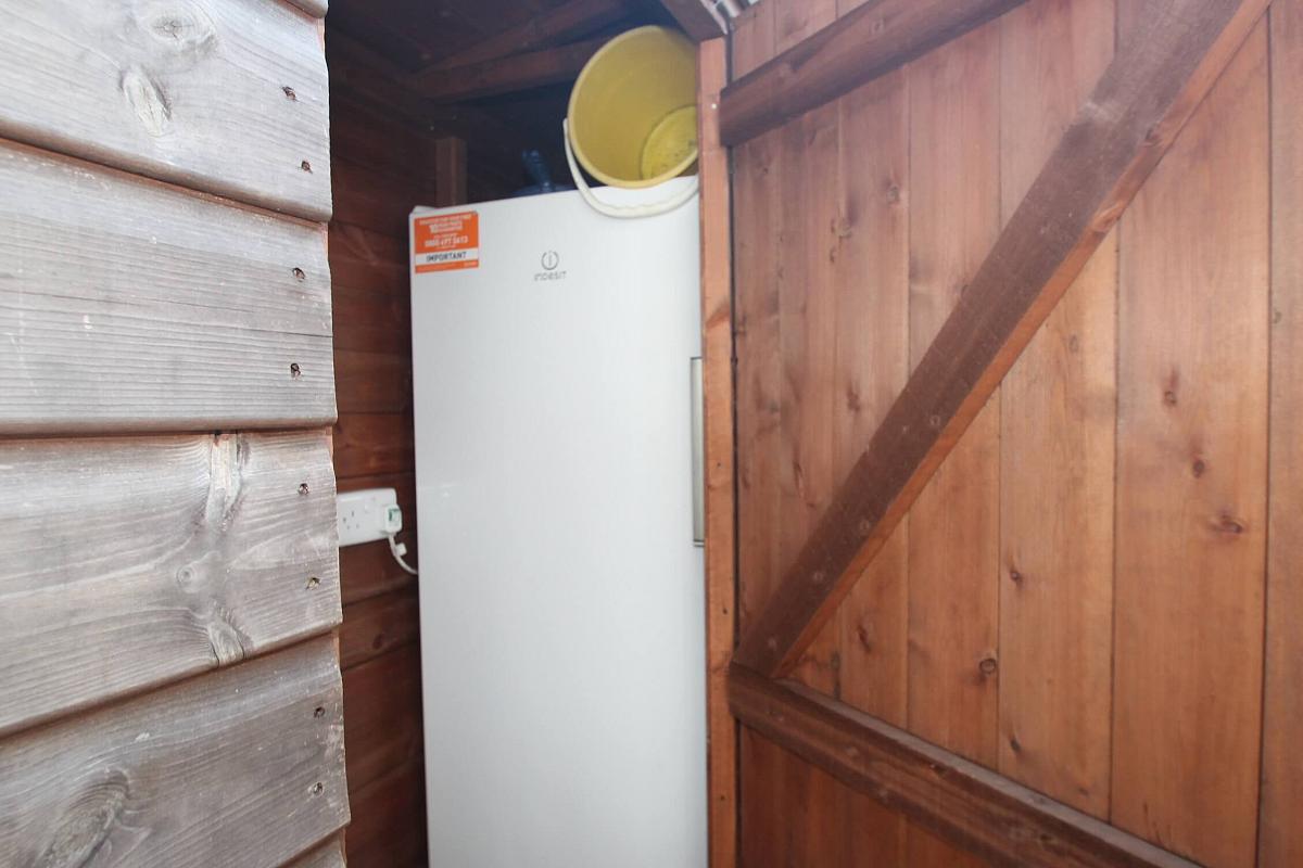 outside shed with fridge freezer