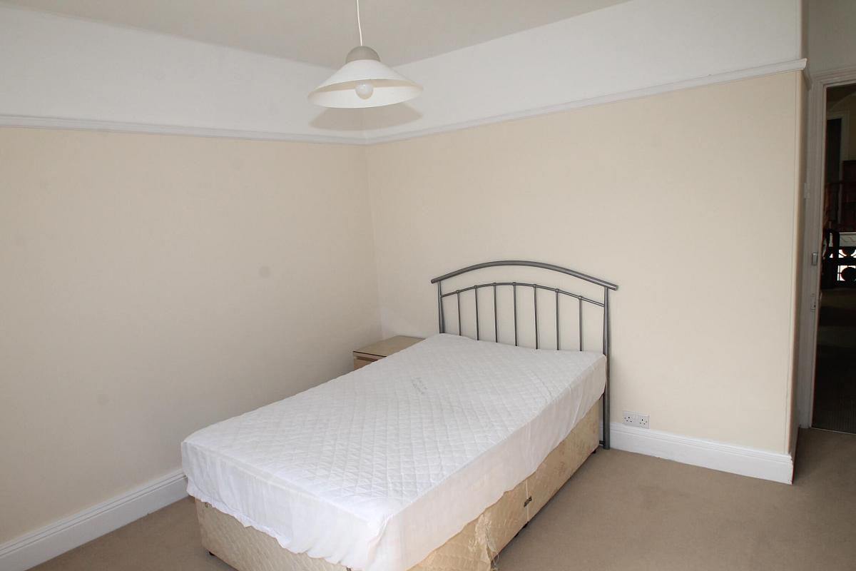 Third bedroom with double bed and bedside table