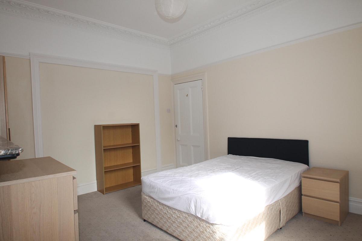 Second bedroom with double bed, two door wardrobe, shelving unit and bedside table
