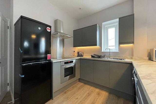 Shared kitchen with fridge freezer, hob and cooker