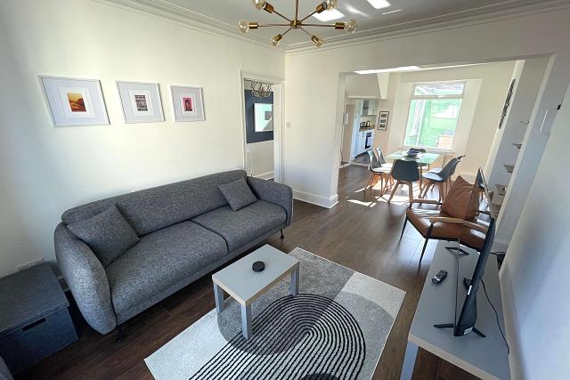 open plan living and dining area leading into kitchen